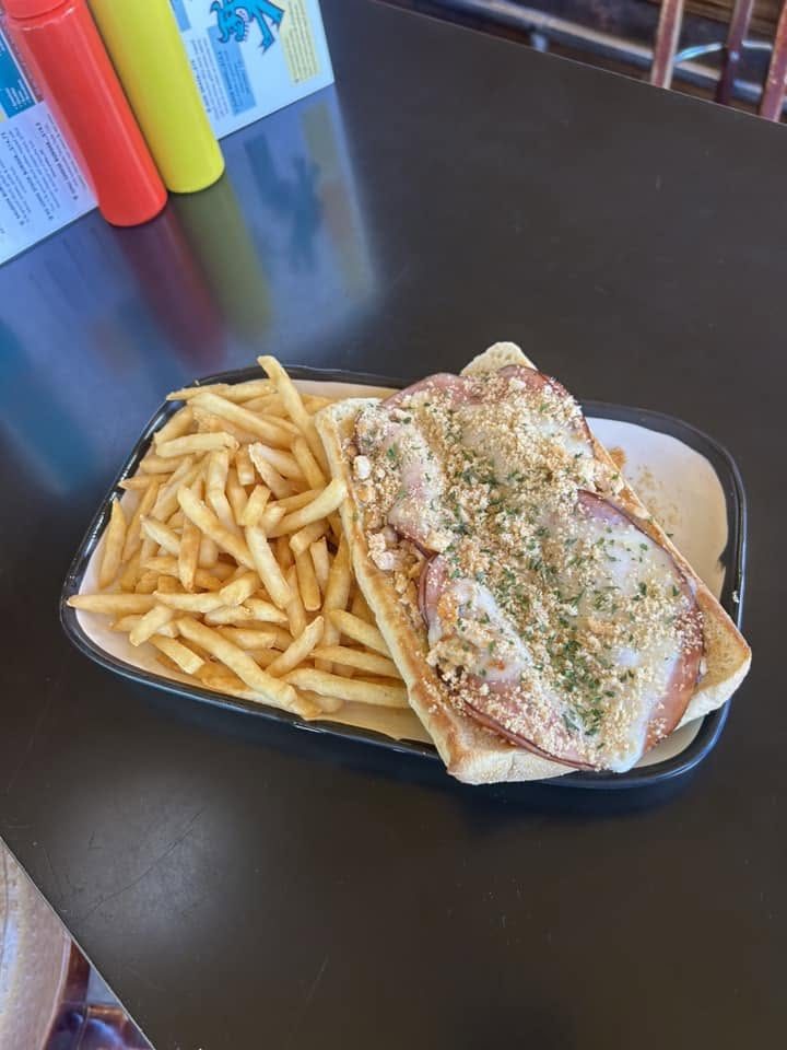 A sandwich with fries